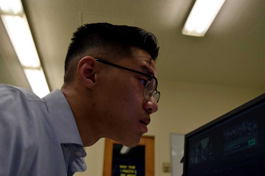 Journalism senior Brian Truong goes through Mustang Gameday's rundown hours before the start of the show. Cal Poly Graphic Arts building, San Luis Obispo, CA. Oct. 26.